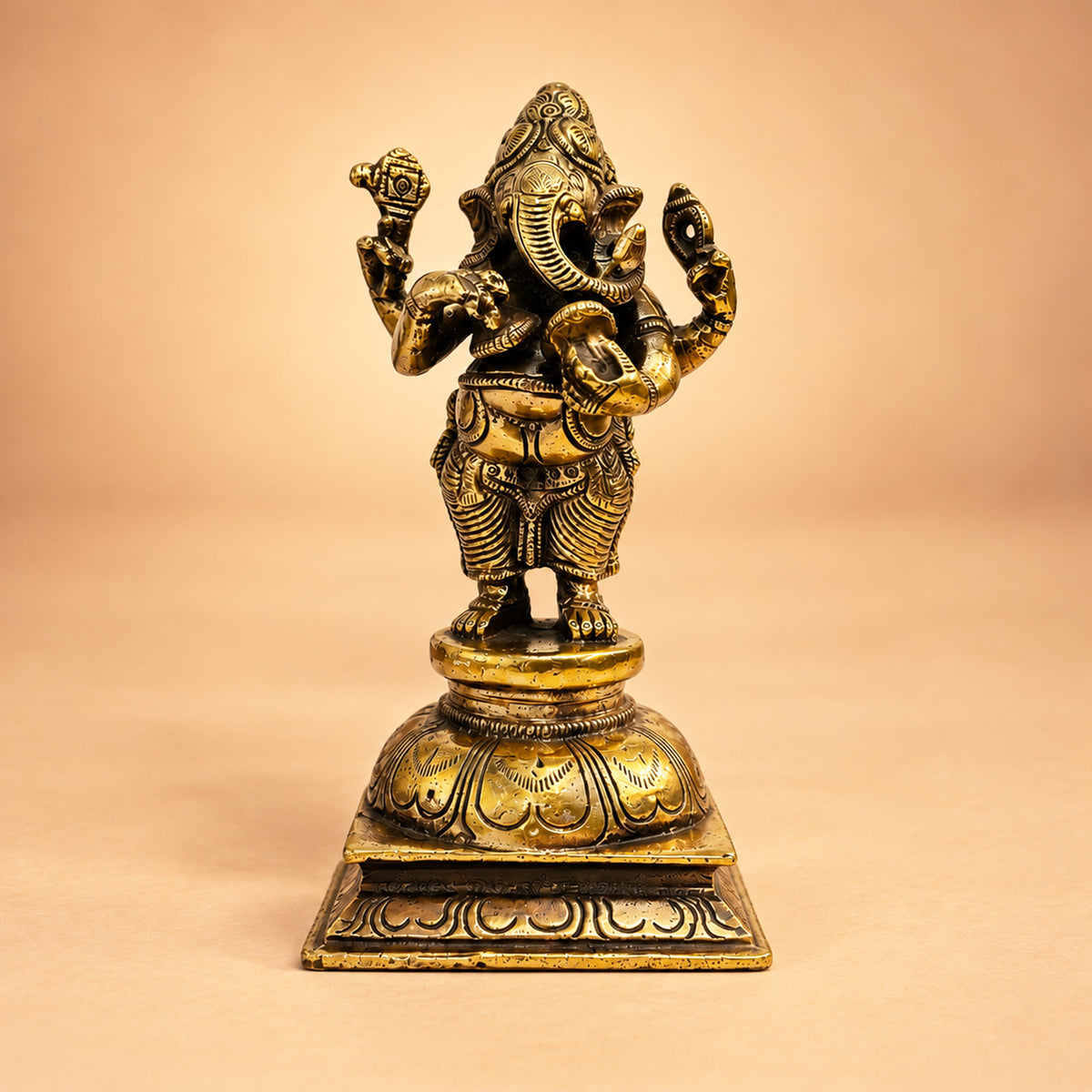 Front view of the golden-finish Brass Standing Ganesha idol