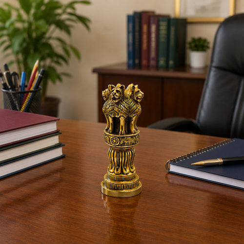 Brass Ashok Pillar on office desk with Indian flag