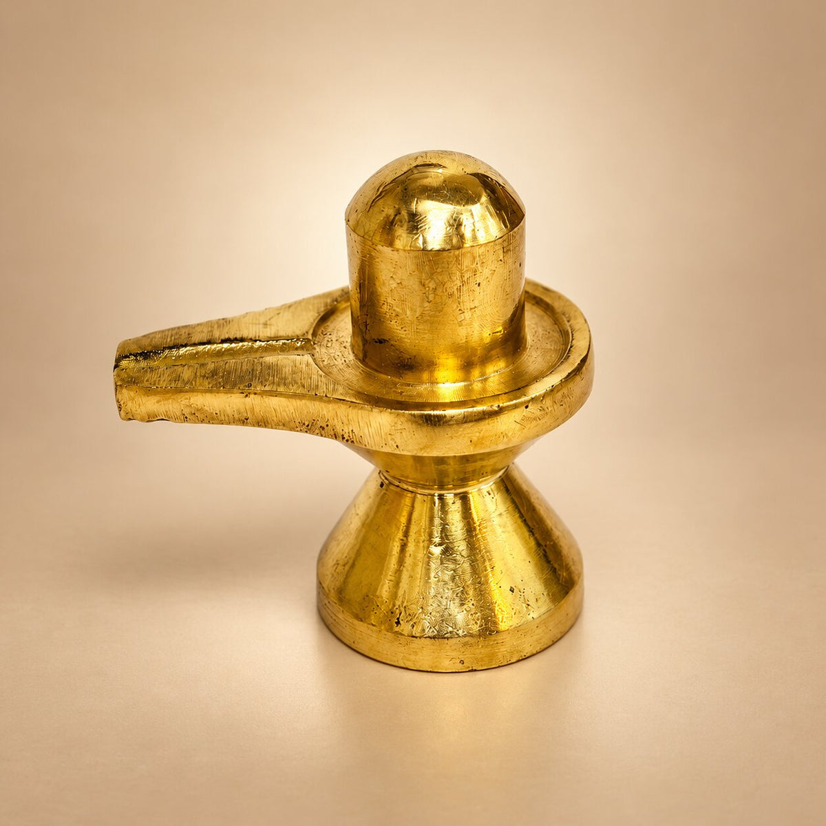 Polished golden brass Shivling with jalhari base, front view