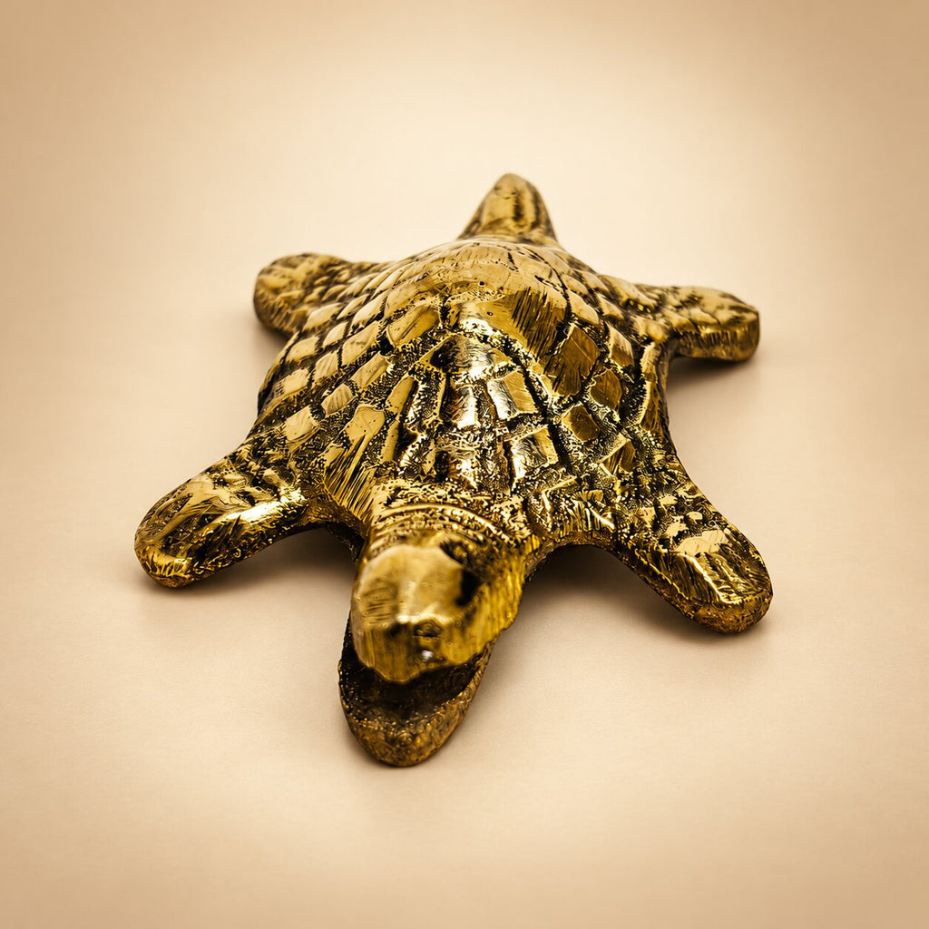 Detailed view of golden brass tortoise showpiece with etched shell pattern