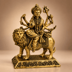 Brass Durga idol held in hands