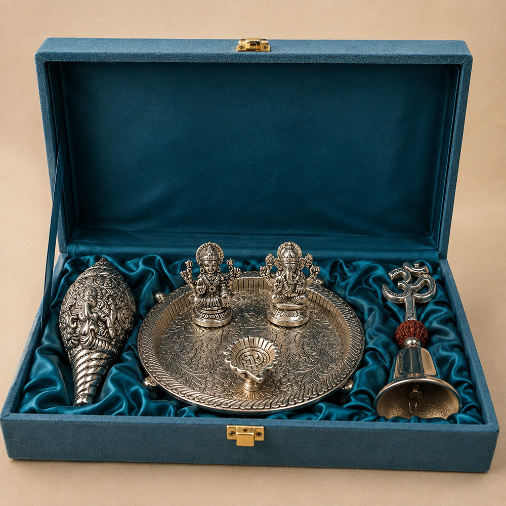 Silver Pooja Set on dark background – Thali, Sankh and Om Bell